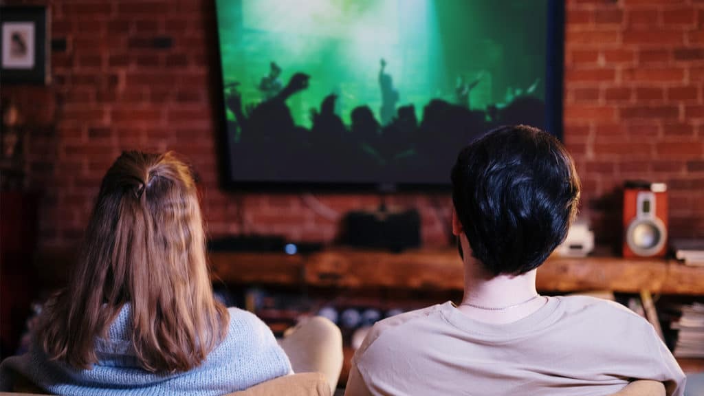 Young couple watching a church livestream