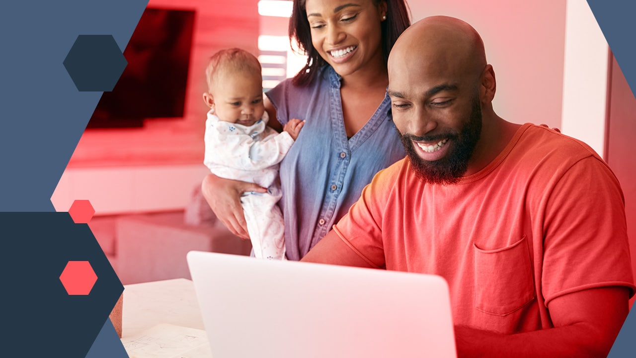 husband and wife with infant watching church livestream