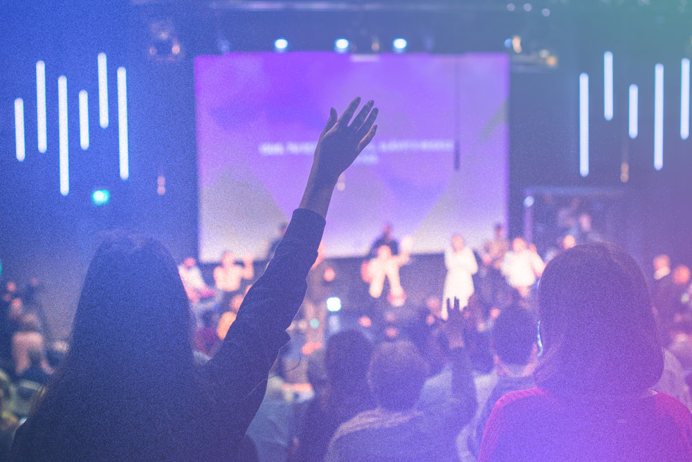 Woman worshipping in church